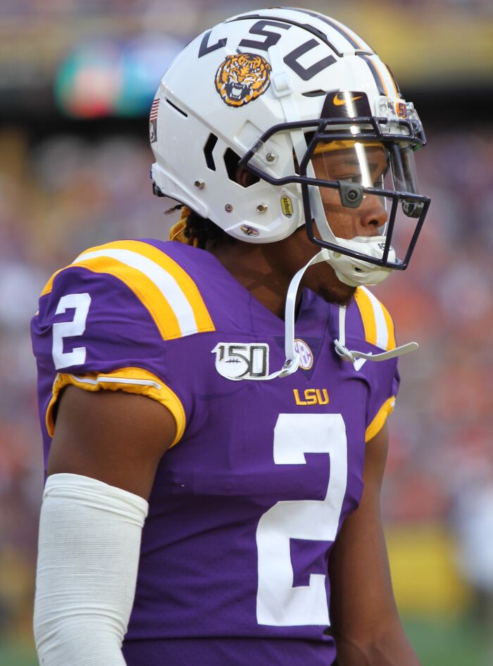 American football player in LSU uniform and helmet, representing highest paid athletes in 2025.