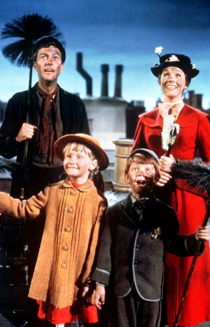 Four chimney sweeps standing on a rooftop, smiling and looking up, illustrating random comparisons that affect perception of time.