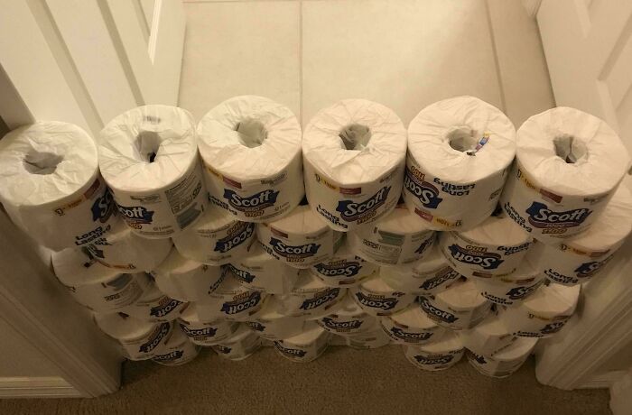 Stacked rolls of toilet paper blocking a doorway, showcasing one of the funniest parents ever prank ideas.
