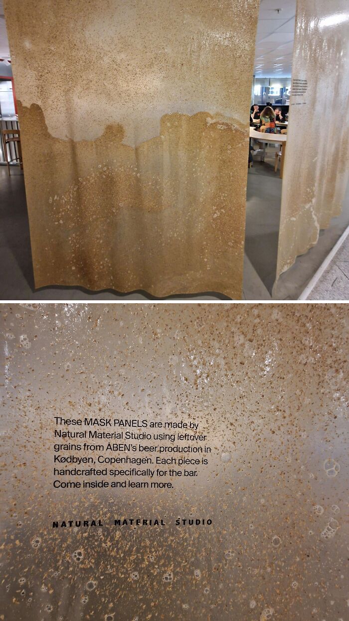 Rusty metal panels displayed indoors showcasing material used in a Danish prison cell, highlighting Denmark's unique design approach.