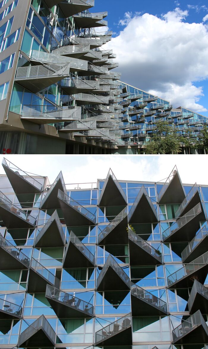 Modern Danish prison cell building with unique angled balconies and extensive glass windows under a blue sky.