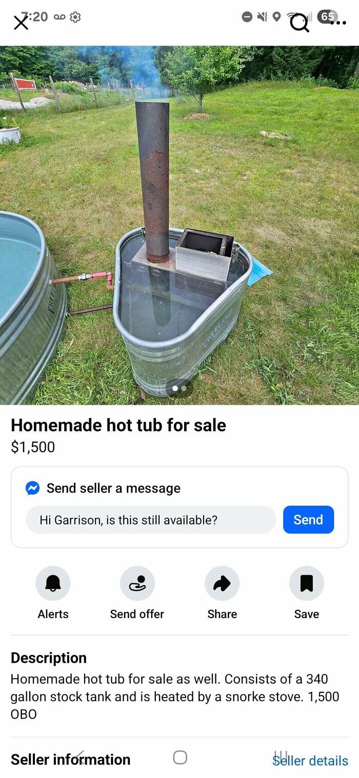 Homemade redneck engineer hot tub made from a stock tank with a snorke stove heating setup outdoors on grass.
