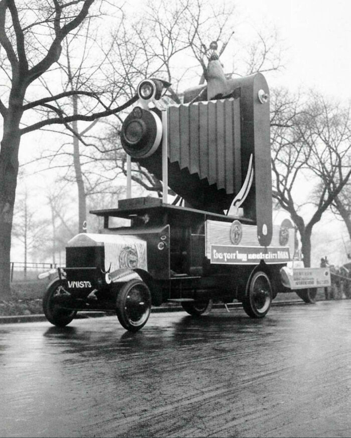 Vintage photo showing a large camera mounted on a truck, highlighting old photos and people’s lives from a different time.