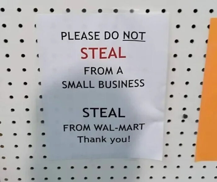 Funny and bizarre sign humorously urging not to steal from small business but from Wal-Mart instead, combining the holy and cursed.