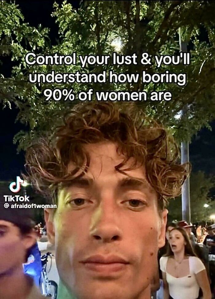Close-up selfie of a young man with curly hair at night among a crowd, featured in TikTok screenshots to feel smart.