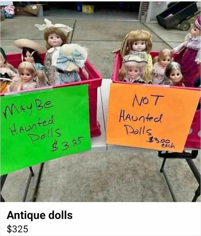 Boxes of antique dolls labeled maybe haunted dolls and not haunted dolls at a flea market combining the holy and the cursed.