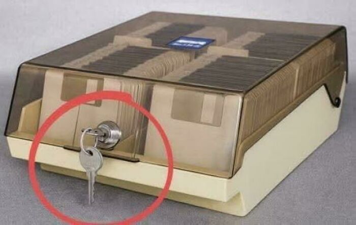 Vintage floppy disk storage box with key lock, showcasing retro computer accessories to make you feel old as heck nostalgia.