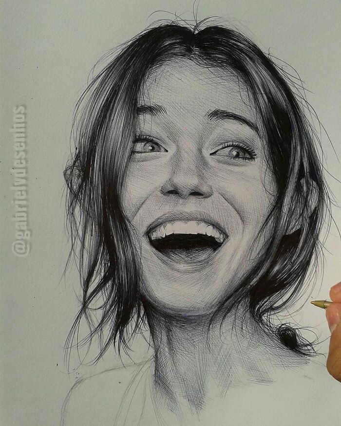 Hyper-realistic portrait drawing of a smiling woman created using only a ballpoint pen by a skilled artist.