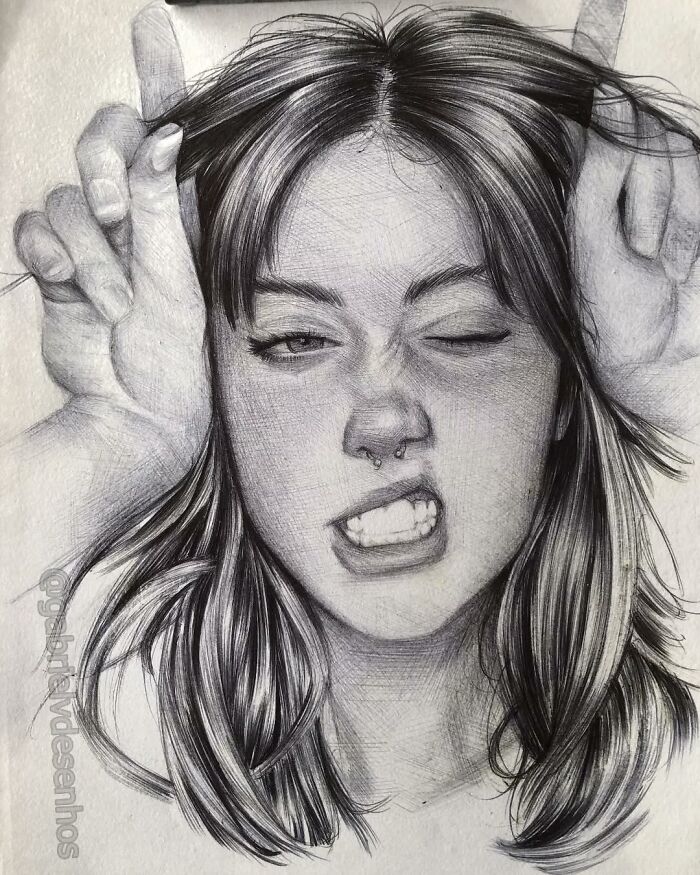 Portrait of a woman with expressive face and loose hair, created with detailed ballpoint pen drawing resembling a photograph.