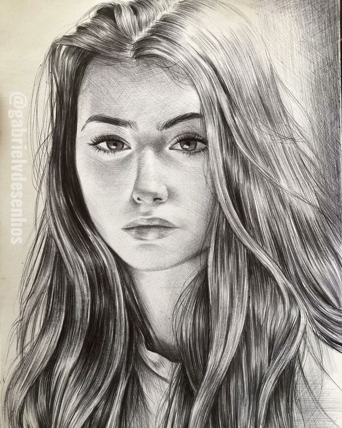 Realistic ballpoint pen portrait of a young woman with long hair, showcasing detailed shading and lifelike features.