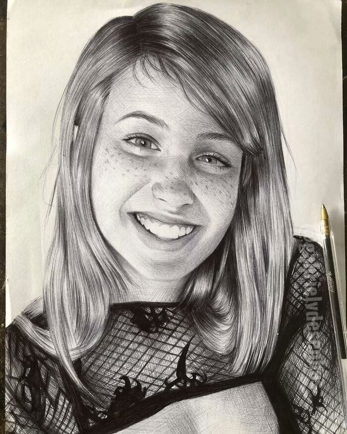 Realistic portrait of a smiling young woman created using only a ballpoint pen showcasing detailed artistry.