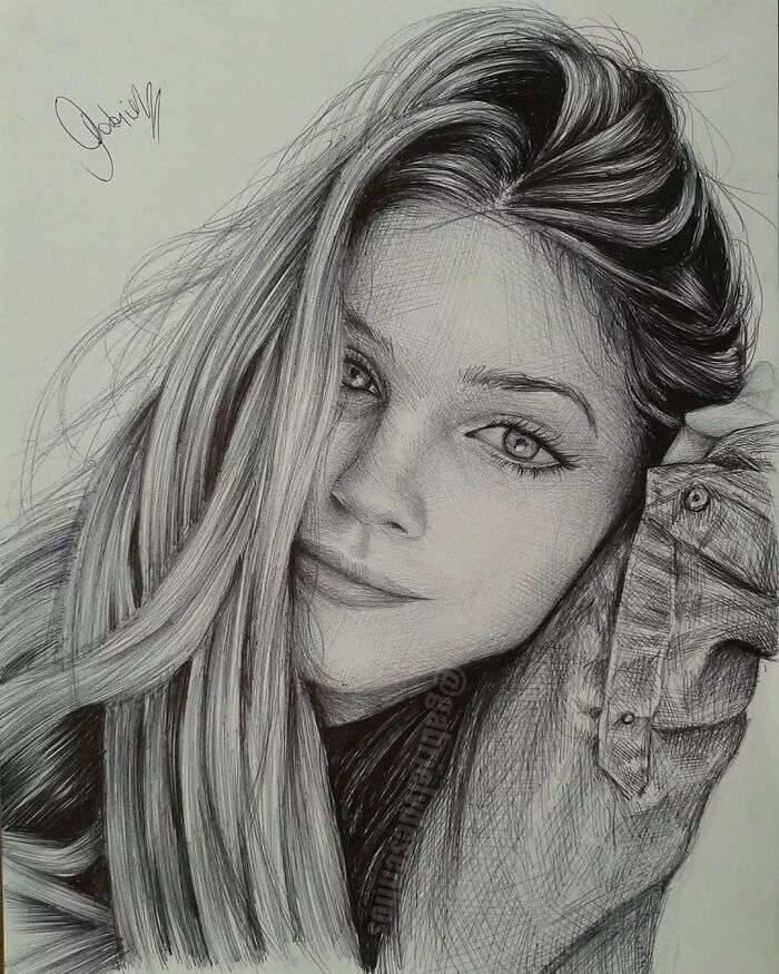 Hyper-realistic ballpoint pen portrait of a young woman with detailed hair and lifelike facial features.