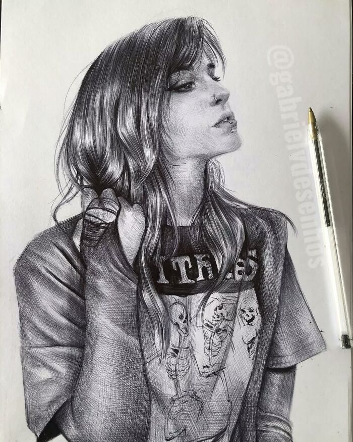 Realistic ballpoint pen portrait of a woman with long hair wearing a skeleton print shirt, showcasing detailed pen art.