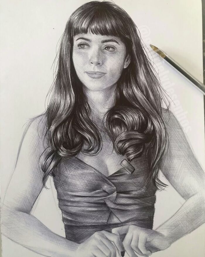 Realistic ballpoint pen portrait of a woman with long hair and detailed shading showcasing artist skill and technique.