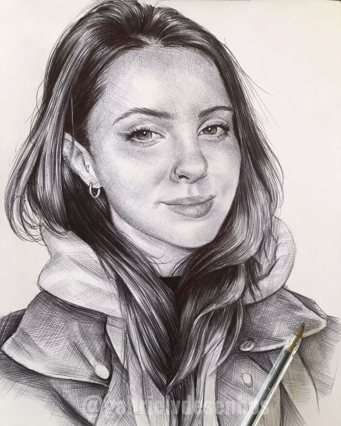 Realistic portrait of a young woman created with a ballpoint pen, showcasing detailed shading and lifelike features.