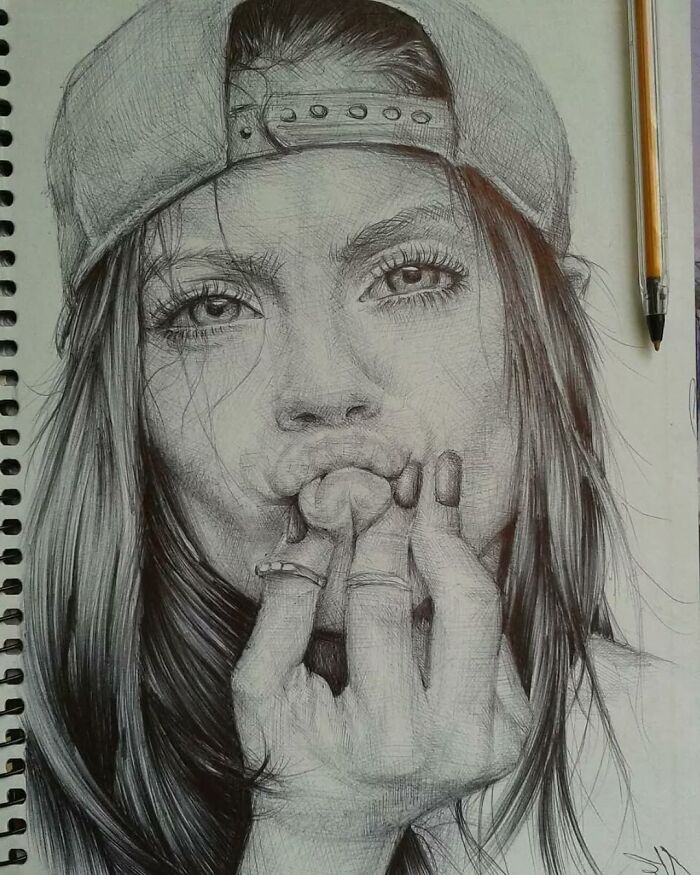 Realistic ballpoint pen portrait of a woman wearing a cap, showing detailed shading and lifelike facial features.