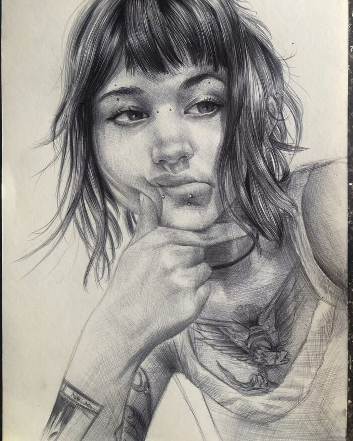 Realistic portrait created using only a ballpoint pen, showcasing detailed facial features and intricate shading.