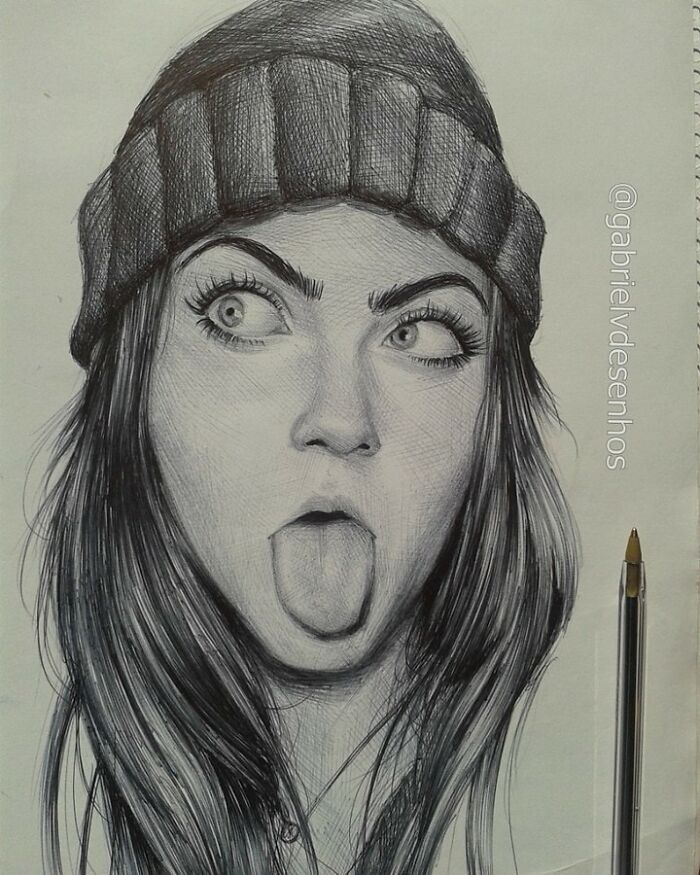 Realistic ballpoint pen portrait of a woman wearing a beanie hat with tongue out, showcasing detailed pen art skills.