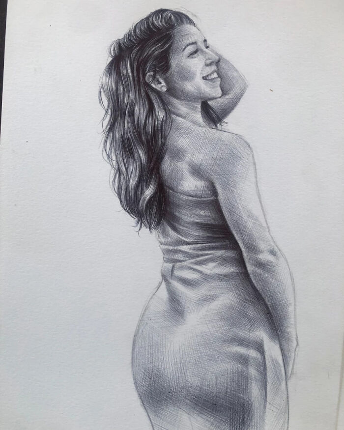 Realistic portrait of a smiling woman with flowing hair created using only a ballpoint pen drawing technique.