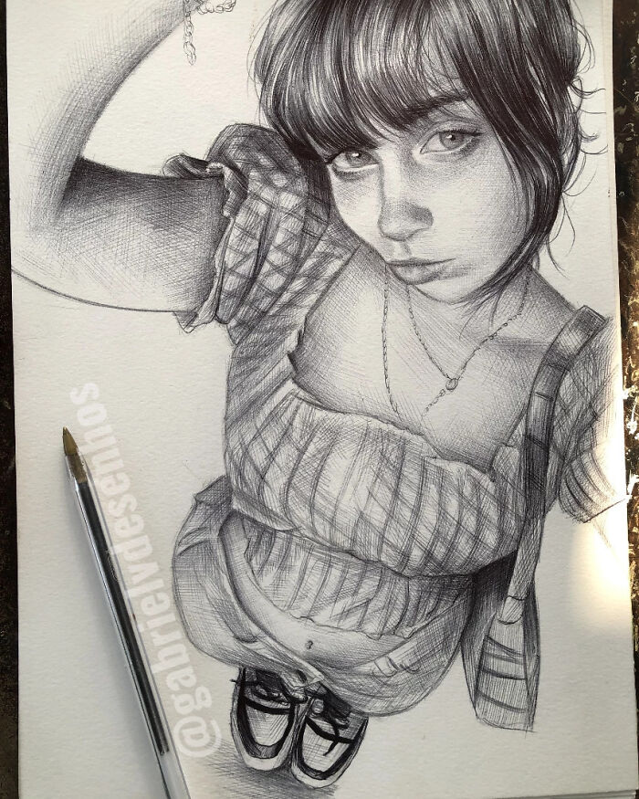 Hyper-realistic ballpoint pen portrait of a woman with detailed shading and texture, showcasing ballpoint pen art skills.