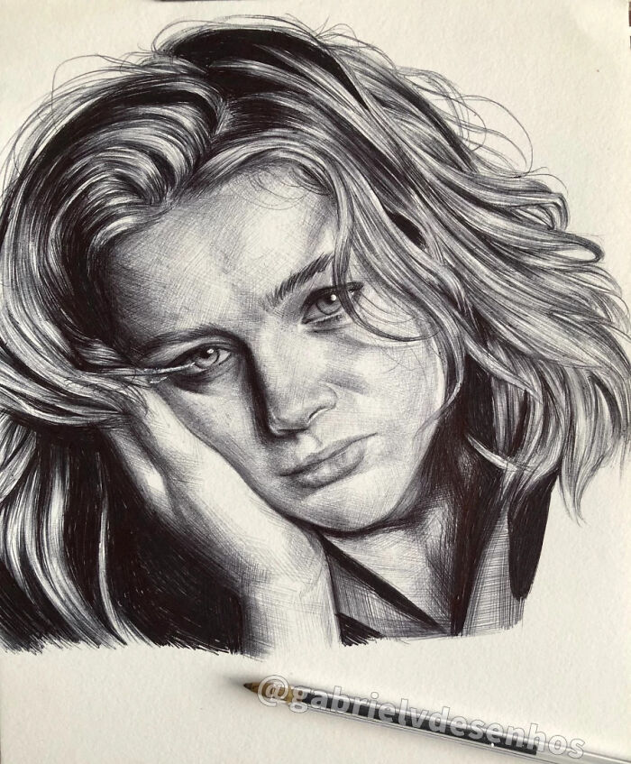 Detailed ballpoint pen portrait of a woman with flowing hair, showcasing realistic shading and photographic quality.