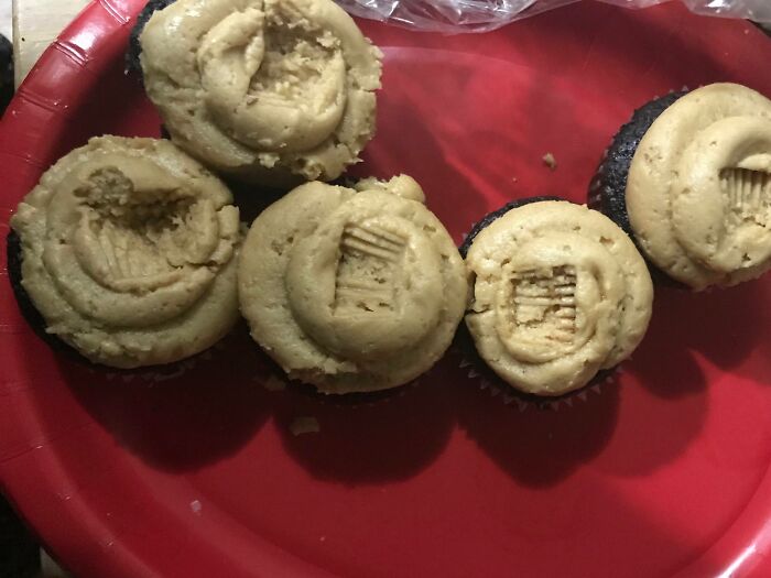 Partially eaten peanut butter cupcakes left on a plate, showcasing messy behavior typical of awful roommates.