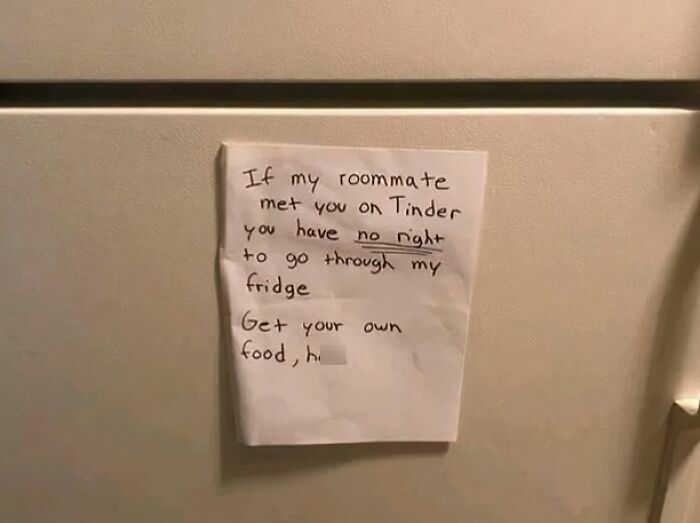 Handwritten note on fridge warning awful roommates to stop going through food without permission.