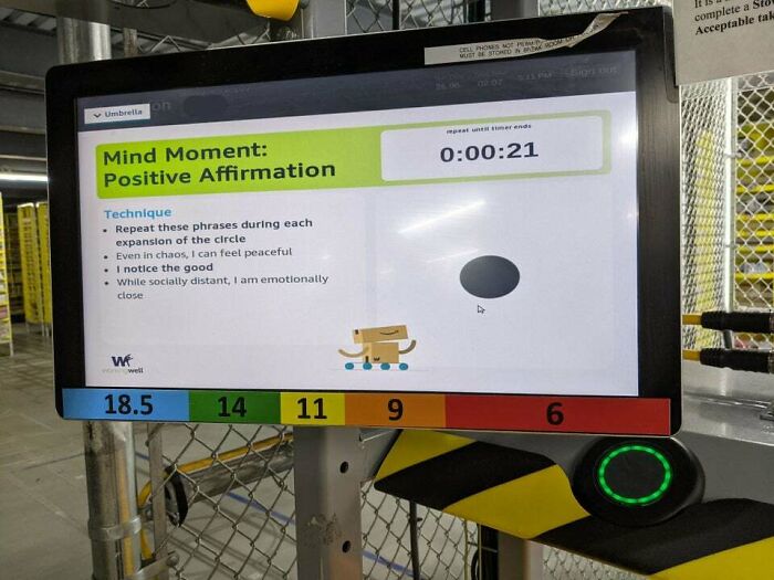 Warehouse worker’s positive affirmation screen showing a timer and calming phrases in an industrial setting.