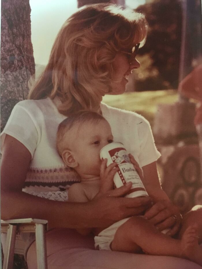 Mom holding her baby outdoors, sharing a tender moment in one of the happiness-inducing pics of moms.