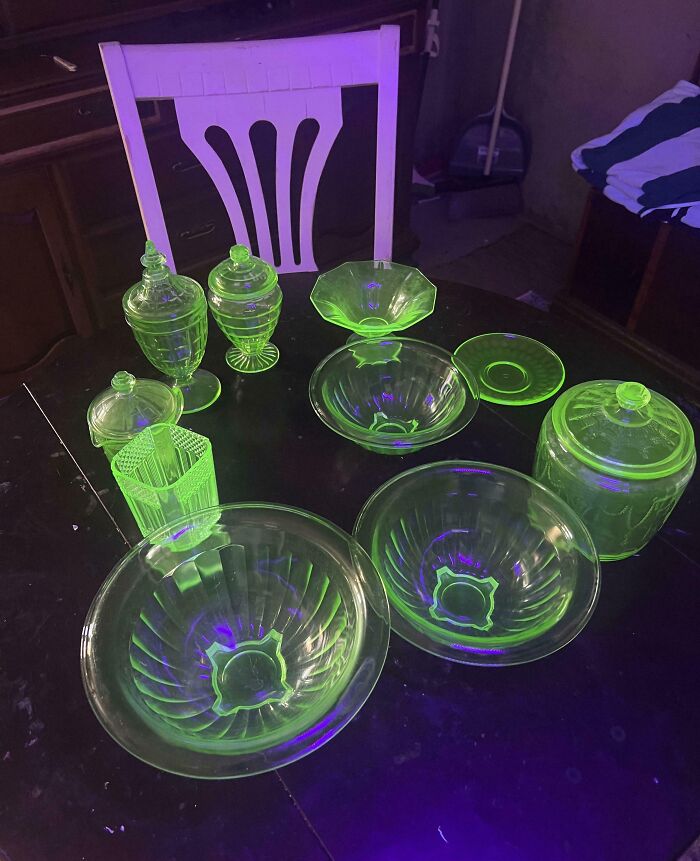 Glowing green vintage glassware displayed on a table, evoking warmth and happiness in wholesome mom moments.