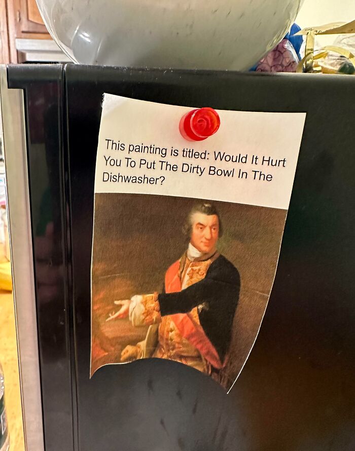 Funny parent humor shown on fridge with a printed classical painting and a note about putting dirty bowls in the dishwasher.