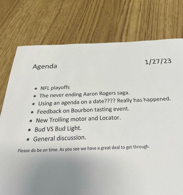 Printed agenda on a wooden table with funny points showing the humor of funniest parents ever in daily life.