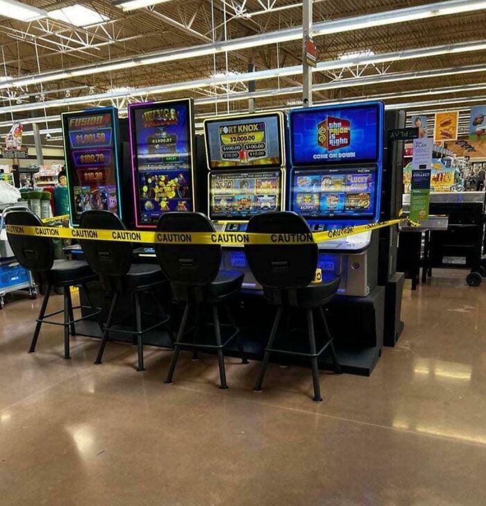 Slot machines in a store blocked off with caution tape representing a dystopian real-life scene in the US