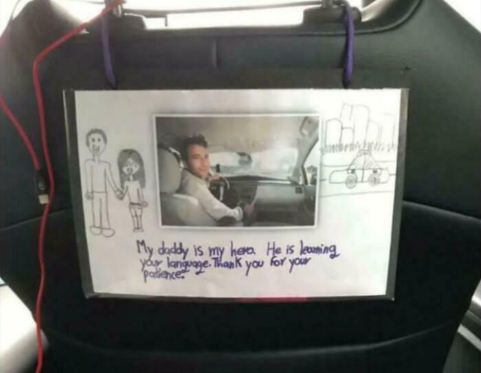Handwritten note in Uber car from child explaining driver is a hero learning language, inspiring heartwarming stories to cleanse negativity.