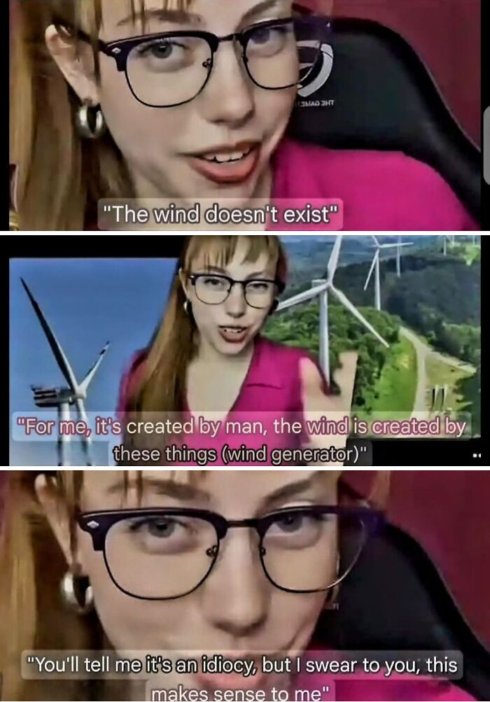 Young woman in glasses explains absurd scientific takes about wind being man-made near wind generators for modern society.