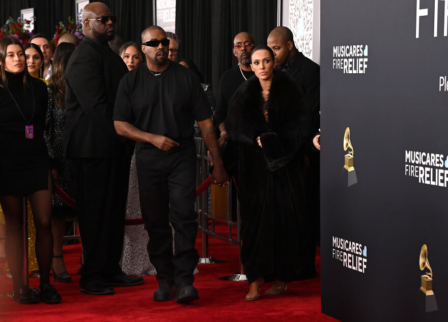Kanye West and Bianca Censori walking the red carpet at a charity event, highlighting net worth and empire growth. Kanye West and Bianca Censori walking the red carpet at a charity event, highlighting net worth and empire growth.