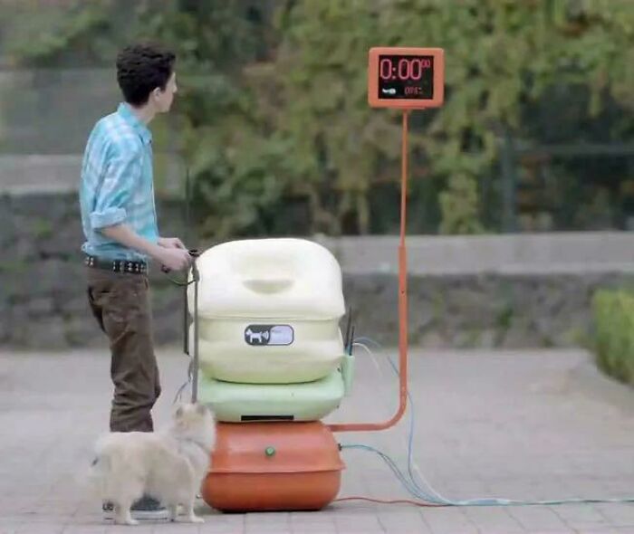 Person with dog using an automated device outside, illustrating one of the inspiring facts better than watching the news.