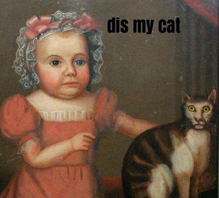 Child in medieval-style dress standing beside a wide-eyed cat with text dis my cat showing medieval cats obsession.