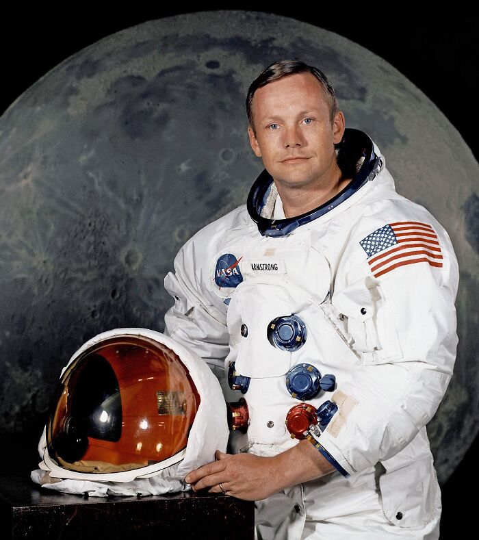 Astronaut in a space suit with American flag, representing famous historical quotes often believed true but aren’t.