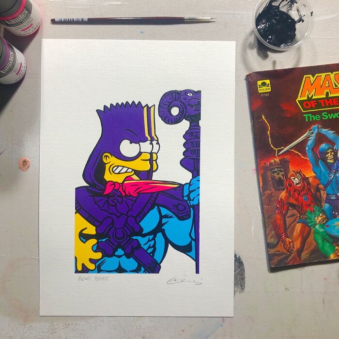 Pop mash artwork combining cartoon character with pop culture elements, displayed on white paper with painting supplies nearby.