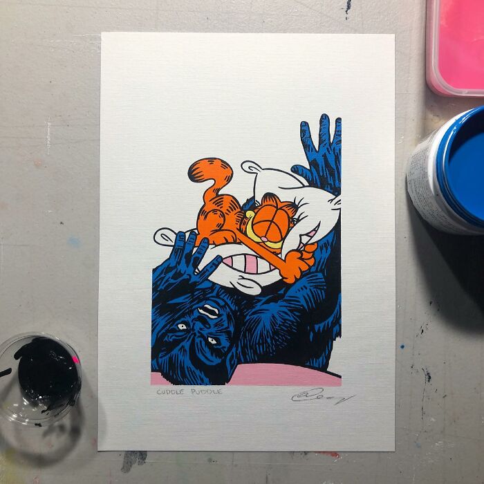 Pop culture and cartoon character mash-up art featuring a dark blue ape and an orange cat cuddling.