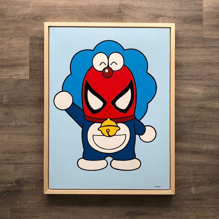 Framed pop culture and cartoon character mash-up artwork featuring a blue figure with a red Spiderman mask.