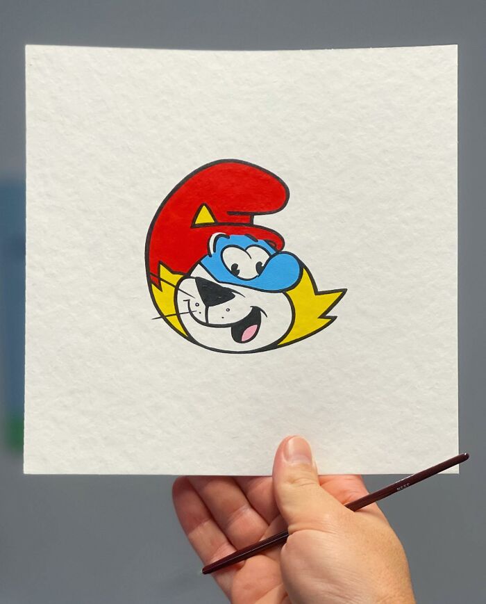 Hand holding artwork of a pop culture and cartoon character mash-up, showcasing unique pop mash style.