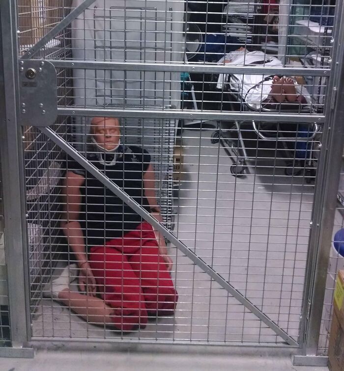 Mannequin in red pants kneeling inside metal cage, showing unsettling workplace scenario in creepy jobs that should pay more.