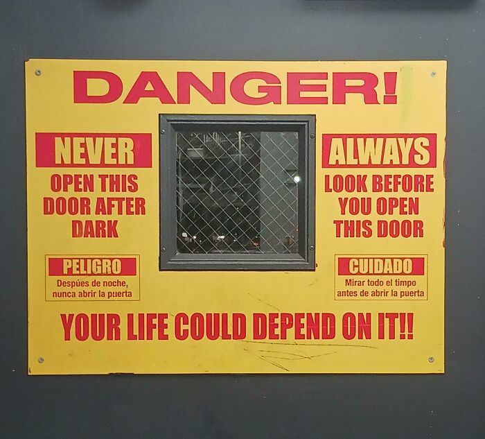 Warning sign with safety instructions on a door, highlighting risks in unsettling work environments that jobs should pay more for