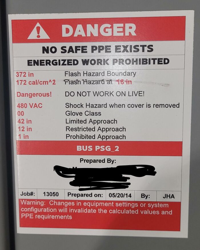 Danger sign about no safe PPE and shock hazards, illustrating creepy and unsettling jobs that should pay more.