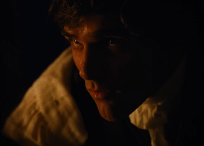 Close-up of Jacob Elordi in dark lighting, portraying a moody character in the Wuthering Heights teaser film. Close-up of Jacob Elordi in dark lighting, portraying a moody character in the Wuthering Heights teaser film.