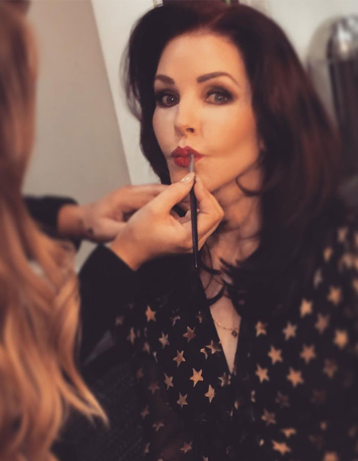 Lisa Marie Presley having makeup applied, highlighting the lawsuit revealing her heartbreaking final moments. Lisa Marie Presley having makeup applied, highlighting the lawsuit revealing her heartbreaking final moments.
