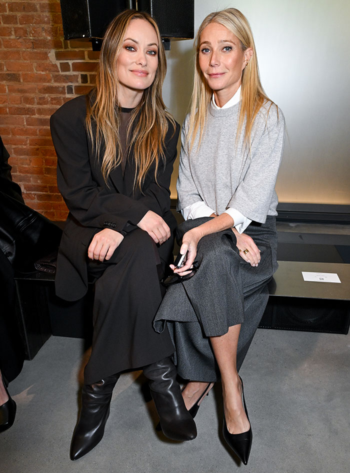 Olivia Wilde sitting in a sheer outfit without a bra, flashing toned abs during New York Fashion Week event. Olivia Wilde sitting in a sheer outfit without a bra, flashing toned abs during New York Fashion Week event.