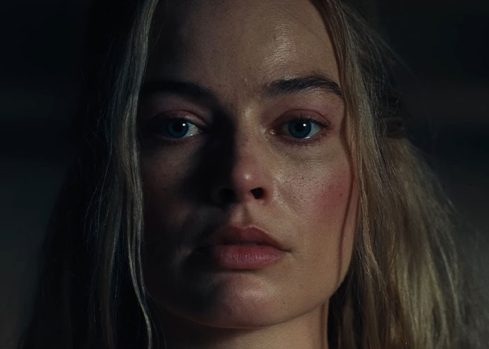 Close-up of Margot Robbie’s face from Wuthering Heights teaser showing 1800s period drama mood and intense expression. Close-up of Margot Robbie’s face from Wuthering Heights teaser showing 1800s period drama mood and intense expression.
